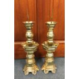 A good pair of tall Chinese brass tapering candles