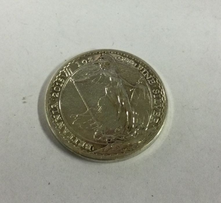 A silver 1 ounce coin. Approx. 31 grams. Est. £10