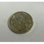 A silver 1 ounce coin. Approx. 31 grams. Est. £10