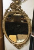 A large circular gilt frame mirror. Est. £40 - £60