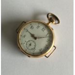 A lady's 18 carat gold wristwatch with white ename