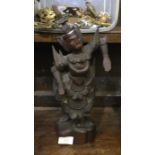 A carved Eastern figure of a dancing lady on woode