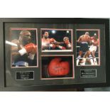 An unusual cased signed boxing glove and photos of