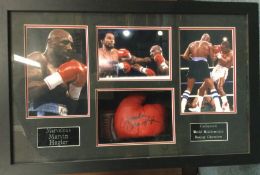 An unusual cased signed boxing glove and photos of
