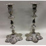A pair of George III six shell cast candlesticks. London 1759. By James Morrison. Approx. 997 grams.