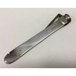 A silver cigar cutter. London 1910. By Wright and Davies. Approx. 110 grams. Est. £60 - £80.