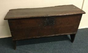 A 17th century plank top coffer. Est. £100 - £150.