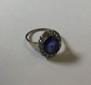 An antique diamond oval mounted cluster ring in pl