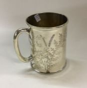 A Victorian silver mug engraved with leaves. Londo