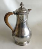 A good Georgian silver coffee pot with swag decora