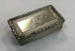 A large William IV silver snuff box with chased de