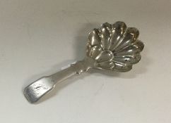 A George III silver caddy spoon. Birmingham 1832.