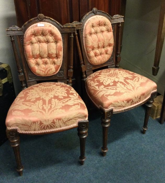 A pair of Victorian button back chairs.