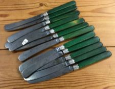 A set of twelve silver handled knives. Approx. 222