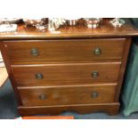 A mahogany chest of three drawers.