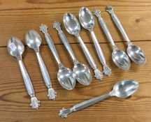 GEORG JENSEN: A set of eight silver spoons of typi