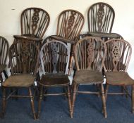 A matched set of twelve wheel back chairs.