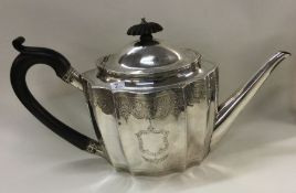 A Georgian bright cut silver teapot. London 1795.