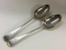 A good pair of engraved silver serving spoons. Lon