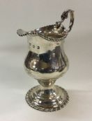 A George III silver cream jug. London 1775. By TS.