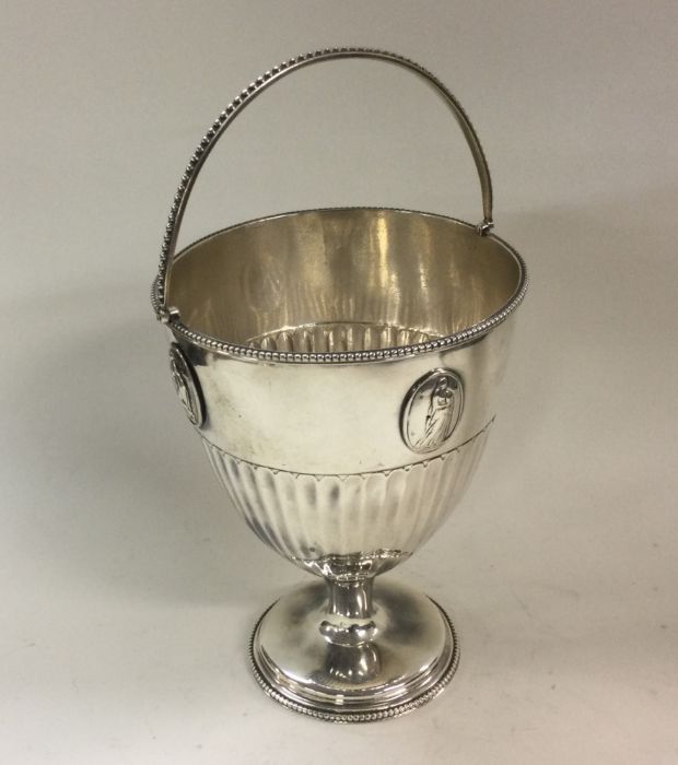 A George III Neo-classical swing handled silver ba - Image 2 of 3