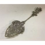 A good quality preserve spoon decorated with a tav