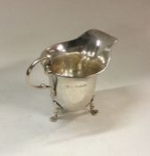 A Georgian style silver cream jug. Birmingham. App