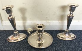 A pair of Old Sheffield Plated candlesticks togeth