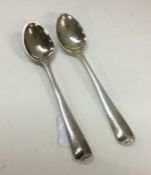 A small pair of Georgian silver spoons. Approx. 10 grams. Es