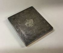 A heavy Middle Eastern silver cigarette case with
