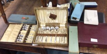 Cased cutlery sets.
