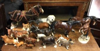 A large collection of china horses.