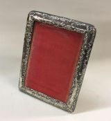 A chased silver picture frame. Birmingham 1900. Ap