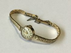 ROLEX: A ladies 9 carat wristwatch on mesh strap.