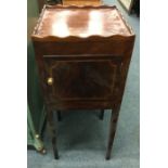 An Antique single door cabinet.