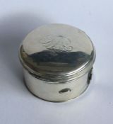 A Georgian silver hinged top circular box with ree