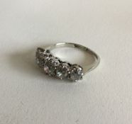 A good Victorian five stone diamond half hoop ring