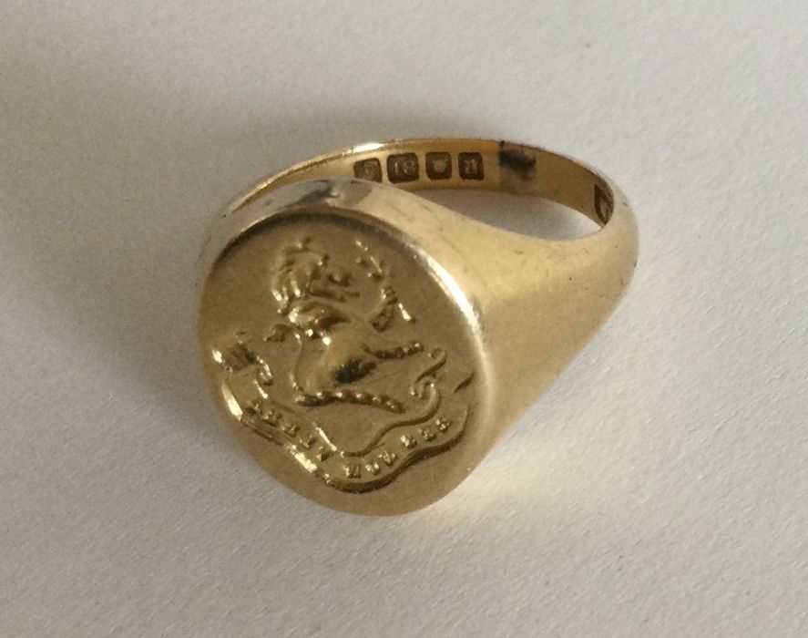 An 18 carat gold crested signet ring of oval form. - Image 2 of 2