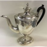 A large George III baluster shaped silver coffee p