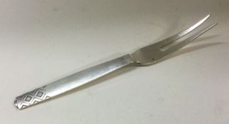GEORG JENSEN: A heavy Danish silver fork. Approx.