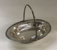 A good George III pierced silver basket engraved w