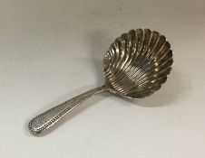 A George III silver caddy spoon. London 1807. By W