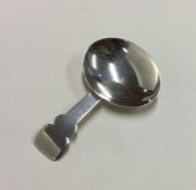 An unusual Georgian silver shaped caddy spoon. Lon