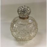 CHESTER: A heavy silver mounted glass scent bottle
