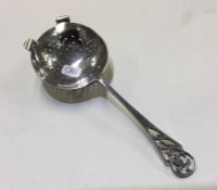 A pierced silver tea strainer. Sheffield. Approx.