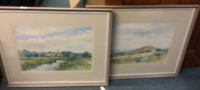A pair of framed and glazed water colours.