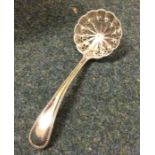 A heavy bead pattern silver sifter spoon. London.