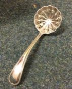 A heavy bead pattern silver sifter spoon. London.