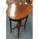 A mahogany occasional table.