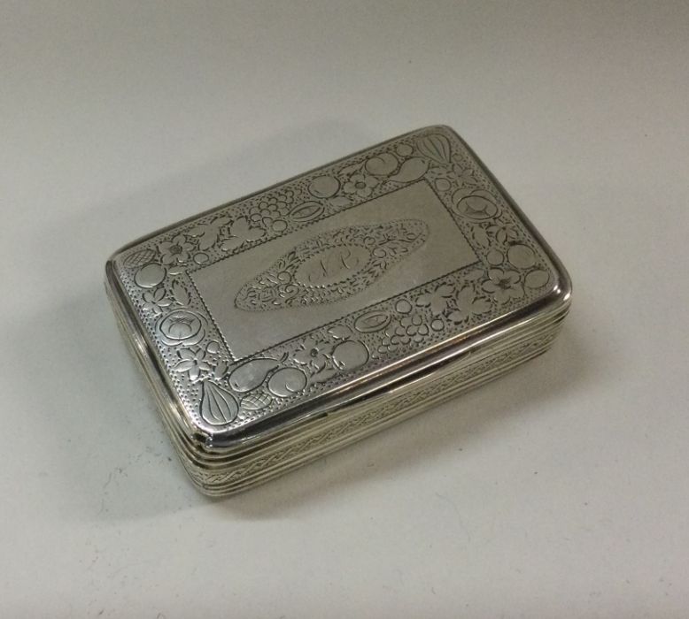 A George III silver snuff box with fruit decoratio